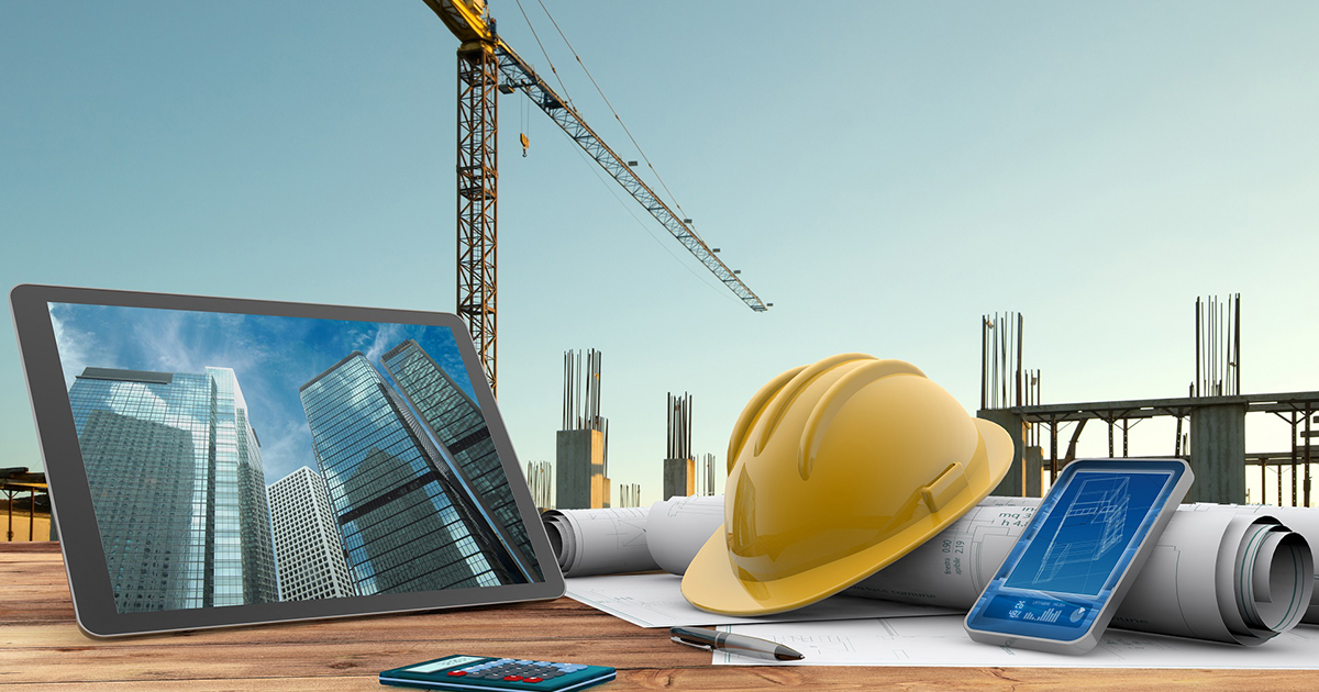 construction hat, tablet and plans
